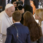 
              FILE - Kateryna Prokopenko, right, wife of Azov Battalion Commander Denys Prokopenko, and Yuliia Fedosiuk, second from right, from Ukraine, talk with Pope Francis, at the end of the weekly general audience, in St. Peter's Square at the Vatican, Wednesday, May 11, 2022. Francis has drawn criticism from some in the West for refusing to condemn Russia or President Vladimir Putin by name for launching the invasion, though he has stepped up his criticism of the atrocities Russian forces have committed against Ukrainian civilians and recently met with the wives of two Ukrainian soldiers holding out at the besieged steel mill in Mariupol. (AP Photo/Domenico Stinellis, File)
            