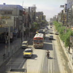 
              FILE - Vehicles are driven on the right side of a street, under the control of the U.S., in Naha, Okinawa island, Japan, in 1971. Okinawa on Sunday, May 15, 2022, marks the 50th anniversary of its return to Japan on May 15, 1972, which ended 27 years of U.S. rule after one of the bloodiest battles of World War II was fought on the southern Japanese island. In 1978, six years after the 1972 reversion of Okinawa to Japan, the traffic direction was officially changed back to driving on the left-hand side of the street, to follow Japan's traffic rules. (AP Photo/Y. Jackson Ishizaki, File)
            