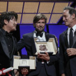
              Song Kang-ho, winner of the award for best actor for 'Broker,' from left, writer/director Ruben Ostlund, winner of the Palme d'Or for 'Triangle of Sadness' and jury president Vincent Lindon appear during the awards ceremony of the 75th international film festival, Cannes, southern France, Saturday, May 28, 2022. (Photo by Joel C Ryan/Invision/AP)
            