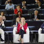 
              President of the European Commission, Ursula Von der Leyen, left, French president Emmanuel Macron, right, and European Parliament President Roberta Metsola applaud during the Conference on the Future of Europe, in Strasbourg, eastern France, Monday, May 9, 2022. Macron traveled to Strasbourg on Monday as the final report on the Conference of Europe was set to be presented by EU institutions leaders. France currently holds the six-month rotating presidency of the Council of the EU. (AP Photo/Jean-Francois Badias)
            