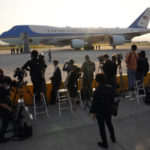 
              Journalists wait for U.S. President Joe Biden to arrive to board Air Force One as he leaves at Yokota Air Base in Fussa, Japan, Tuesday, May 24, 2022. (AP Photo/Eugene Hoshiko)
            