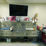 
              A computer monitor and a dry erase easel are among the tools pathologists have use of in each of the autopsy bays in the Mississippi Crime Laboratory in Pearl, Miss., Aug. 26, 2021. (AP Photo/Rogelio V. Solis)
            