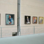 
              A portrait of former German Chancellor Gerhard Schroeder, left, by German artist Joerg Immendorff is displayed as part of the 'Chancellors Gallery' at the chancellery in Berlin, Germany, Wednesday, May 18, 2022. Germany's three governing parties plan to strip former Chancellor Gerhard Schroeder of his office and staff after he maintained and defended his long-standing ties with Russia despite the war in Ukraine.(AP Photo/Markus Schreiber)
            