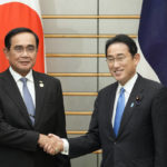 
              Thai Prime Minister Prayuth Chan-ocha, left, shakes hands with Japanese Prime Minister Fumio Kishida at the start of their meeting at the Prime Minister's official residence in Tokyo, Thursday, May 26, 2022. (Franck Robichon/Pool Photo via AP)
            