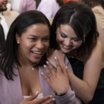 
              Actress and mental health advocate Selena Gomez, hugs youth mental health leader Ayanna Kelly, Wednesday, May 18, 2022, at the White House in Washington, as first lady Jill Biden speaks during the White House Conversation on Youth Mental Health. (AP Photo/Jacquelyn Martin)
            