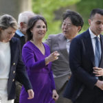 
              From left, Melanie Joly, Foreign Minister of Canada, Annalena Baerbock, Foreign Minister of Germany, Hayashi Yoshimasa, Foreign Minister of Japan, and Luigi Di Maio, Foreign Minister of Italy, walk to dinner at the summit of foreign ministers of the G7 group of leading democratic economic powers, in Weissenhäuser Strand, Thursday, May 12, 2022. The meeting under German presidency will be chaired by Foreign Minister. In addition to the USA and Germany, the G7 also includes Great Britain, France, Italy, Canada and Japan. (Marcus Brandt/pool photo via AP)
            