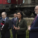 
              A freight train with fodder maize, arriving from the Ukraine, is welcomed by Federal Minister for Agriculture, Regions and Tourism Elisabeth Koestinger, center, Ukraine ambassador Vasyl Khymynets, left, and OEBB CEO Matthias Matthae, right, in Vienna, Austria, Friday, May 6, 2022. (AP Photo/Theresa Wey)
            