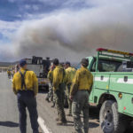 
              Wildland firefighters from several agencies throughout the country wait along state road 283 to be sent into the Hermits Peak and Calf Canyon Fires burning just west of Las Vegas, N.M. (Roberto E. Rosales/Albuquerque Journal)
            
