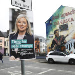 
              A Sinn Fein election poster hangs from a lamp post in West Belfast, Northern Ireland, Tuesday, May 3, 2022. Sinn Fein, a force in Irish republicanism on both sides of the Irish border looks likely to become the largest party in the assembly, according to polls ahead of the May 5, 2022 local elections. (AP Photo/Peter Morrison)
            