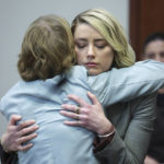 
              Actor Amber Heard hugs her attorney Elaine Bredehoft after she testified in the courtroom in the Fairfax County Circuit Courthouse in Fairfax, Va., Thursday, May 26, 2022. Actor Johnny Depp sued his ex-wife Amber Heard for libel in Fairfax County Circuit Court after she wrote an op-ed piece in The Washington Post in 2018 referring to herself as a "public figure representing domestic abuse." (Michael Reynolds/Pool Photo via AP)
            