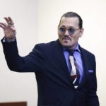 
              Actor Johnny Depp waves as he leaves the courtroom for a recess at the Fairfax County Circuit Court in Fairfax, Va., Thursday, May 5, 2022. Depp sued his ex-wife actor Amber Heard for libel in Fairfax County Circuit Court after she wrote an op-ed piece in The Washington Post in 2018 referring to herself as a "public figure representing domestic abuse." (Jim Lo Scalzo/Pool Photo via AP)
            