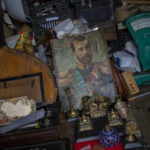 
              A painting of the last Russian Czar, Nicholas II, is surrounded by old items at a flea market stall in Kharkiv, Ukraine, Sunday, May 22, 2022. (AP Photo/Bernat Armangue)
            