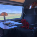 
              A lamp illuminates the desk of a seat on the French high speed TGV train travelling from Paris to Zurich, Saturday, May 21, 2022. The World Economic Forum is encouraging European attendees to come to its exclusive gathering in the Swiss Alps by train. Its part of efforts to burnish the sustainability credentials for an event in Davos that conjures up up images of government leaders, billionaire elites and corporate titans jetting in on carbon-spewing private planes. (AP Photo/Kelvin Chan)
            