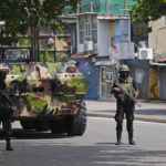 
              Sri Lankan army soldiers patrol during curfew in Colombo, Sri Lanka, Wednesday, May 11, 2022. Sri Lankan authorities deployed armored vehicles and troops on the streets of the capital Wednesday, two days after pro-government mobs attacked peaceful protesters, triggering a wave of violence across the country. (AP Photo/Eranga Jayawardena)
            