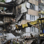 
              Rescuers work at a site of an apartment building destroyed by Russian shelling in Bakhmut, Donetsk region, Ukraine, Wednesday, May 18, 2022. (AP Photo/Andriy Andriyenko)
            