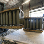 
              U.S. Air Force Staff Sgt. Cody Brown, right, with the 436th Aerial Port Squadron, checks pallets of 155 mm shells ultimately bound for Ukraine, Friday, April 29, 2022, at Dover Air Force Base, Del. President Joe Biden asked Congress on Thursday for $33 billion to bolster Ukraine's fight against Russia, signaling a burgeoning and long-haul American commitment. (AP Photo/Alex Brandon)
            
