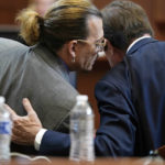 
              Actor Johnny Depp talks to his attorney in the courtroom at the Fairfax County Circuit Court in Fairfax, Va., Wednesday May 4, 2022. Depp sued his ex-wife Amber Heard for libel in Fairfax County Circuit Court after she wrote an op-ed piece in The Washington Post in 2018 referring to herself as a "public figure representing domestic abuse." (Elizabeth Frantz/Pool Photo via AP)
            