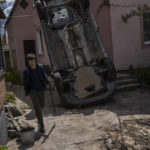 
              A resident carries a shovel to clear the rubble from his house damaged during a shelling in Kharkiv, Ukraine, Monday, May 16, 2022. (AP Photo/Bernat Armangue)
            