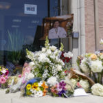 
              A memorial honoring Dr. John Cheng sits outside his office building on Tuesday, May 17, 2022, in Aliso Viejo, Calif. Cheng, 52, was killed in Sunday's shooting at Geneva Presbyterian Church. (AP Photo/Ashley Landis)
            