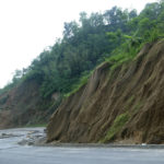 
              Nets cover a slope by a road to prevent soil from slipping on the highway near Medziphema, in the northeastern India state of Nagaland, Tuesday, May 17, 2022. Officials in India say more than 10 people have died in floods and mudslides triggered by heavy rains in the country's northeast region. (AP Photo/Yirmiyan Arthur)
            