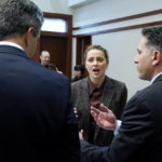 
              Actor Amber Heard talks to her attorneys during a break, in the courtroom at the Fairfax County Circuit Court in Fairfax, Va., Monday May 2, 2022. Actor Johnny Depp sued his ex-wife Amber Heard for libel in Fairfax County Circuit Court after she wrote an op-ed piece in The Washington Post in 2018 referring to herself as a "public figure representing domestic abuse." (AP Photo/Steve Helber, Pool)
            