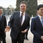 
              FILE - Tesla CEO Elon Musk, center, gestures as he waits for a meeting with Chinese Premier Li Keqiang at the Zhongnanhai leadership compound in Beijing, Wednesday, Jan. 9, 2019. Many people are puzzled on what a Elon Musk takeover of Twitter would mean for the company and even whether he’ll go through with the deal.  If the 50-year-old Musk’s gambit has made anything clear it’s that he thrives on contradiction.   (AP Photo/Mark Schiefelbein, Pool, File)
            