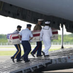 
              U.S. military carry the possible remains of a WWII U.S. airman found in northern Thailand to a waiting C-17 during a repatriation ceremony Wednesday, May 18, 2022, at the U-Tapao Air Base in Rayong province, eastern Thailand. The possible human remains were found at a crash site in a rice field in northern Thailand by the Defense POW/MIA Accounting Agency and were sent to Hawaii where they will be tested to see if they belong to a U.S. pilot who went missing in 1944. (AP Photo/Sakchai Lalit)
            