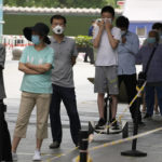 
              Residents line up for mass COVID test on Monday, May 23, 2022, in Beijing. (AP Photo/Ng Han Guan)
            