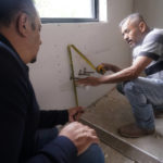 
              Tile subcontractor Horacio Gomez, right, originally from the Mexican state of Michoacan, measures and talks with homebuilder Joshua Correa about plans at a custom home under construction in Plano, Texas, Tuesday, May 3, 2022. There are an estimated 2 million fewer immigrants than expected in the United States, helping fuel a desperate scramble for workers in many sectors, from meatpacking to homebuilding, that are also contributing to shortages and price increases. (AP Photo/LM Otero)
            