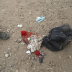 
              Personal items lie on the ground that were left behind by migrants who had crossed the Rio Grande river into the United States and taken into custody of the Border Patrol in Eagle Pass, Texas, Friday, May 20, 2022. As U.S. officials anxiously waited, many of the migrants crossing the border from Mexico on Friday were oblivious to a pending momentous court ruling on whether to maintain pandemic-related powers that deny a chance to seek asylum on grounds of preventing the spread of COVID-19. (AP Photo/Dario Lopez-Mills)
            