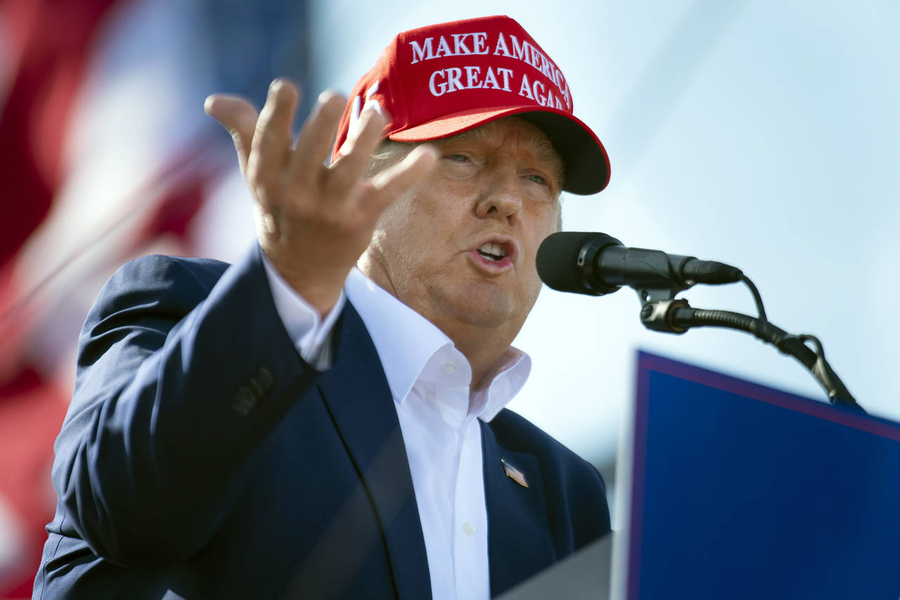 FILE — Former President Donald Trump speaks from the podium during a campaign rally, May 1, 2022,...