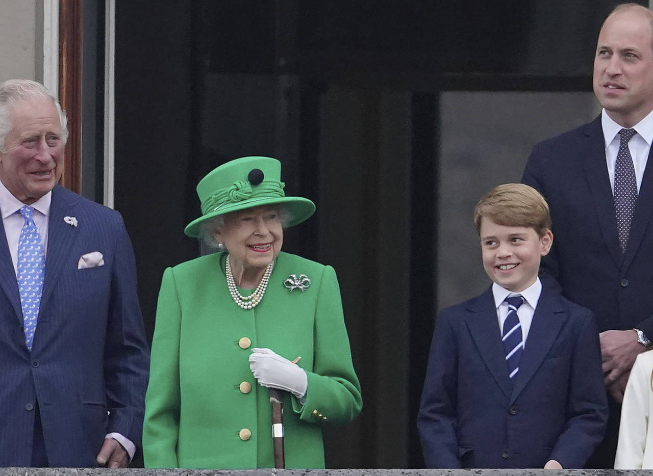 From left, Prince Charles, Queen Elizabeth II, Prince George and Prince William appear on the balco...