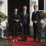 
              NATO Secretary General Jens Stoltenberg is welcomed by Dutch Prime Minister Mark Rutte and Denmark's Prime Minister Mette Frederiksen for a pre-NATO summit meeting in The Hague, Netherlands, Tuesday, June 14, 2022. (AP Photo/Patrick Post)
            