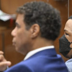 
              Eric Holder, right, looks on, while seated beside his attorney Aaron Jensen, during closing arguments at his trial on Thursday, June 30, 2022, in Los Angeles. (Frederic J. Brown/Pool Photo via AP)
            