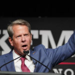 
              Republican Gov. Brian Kemp waves to supporters during an election night watch party, Tuesday, May 24, 2022, in Atlanta. Kemp easily turned back a GOP primary challenge Tuesday from former U.S. Sen. David Perdue, who was backed by former President Donald Trump. (AP Photo/John Bazemore)
            