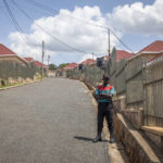 
              FILE - A security guard stands in the street by Hallmark Residences, which is one of the locations expected to house some of the asylum-seekers due to be sent from Britain to Rwanda, in the capital Kigali, Rwanda on May 19, 2022. A group of asylum-seekers asked a U.K. court on Friday, June 10, 2022 to stop the British government sending them on a one-way flight to Rwanda. (AP Photo/File)
            