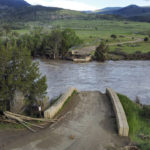
              A washed out bridge shown along the Yellowstone River Wednesday, June 15, 2022, near Gardiner, Mont. Historic floodwaters that raged through Yellowstone National Park may have permanently altered the course of a popular fishing river and left the sweeping landscape forever changed. (AP Photo/Rick Bowmer)
            