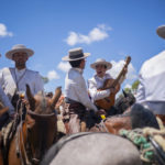 
              Pilgrims ride their horses as they sing on their way to the shrine of El Rocio in Villamanrique, Spain, on Friday June 3, 2022, during the annual pilgrimage in which hundreds of thousands of devotees of the Virgin del Rocio converge in and around the shrine. After a two-year hiatus forced by the pandemic, tens of thousands of pilgrims – many of them outfitted in tiered flamenco dresses, crisp riding suits and wide-brimmed Cordoba hats – descended on the tiny Spanish village of El Rocío to take part in riotously colorful and ancient festival, la Romería del Rocío, or the Rocío virgin pilgrimage. (AP Photo/Joan Mateu Parra)
            