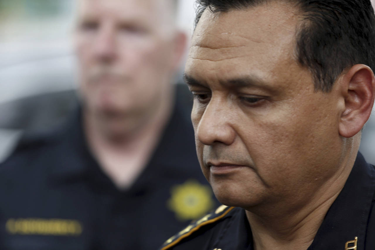 FILE - Harris County Sheriff Ed Gonzalezs pauses as outside a hospital, announcing the identity of ...