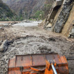 
              In this photo provided Caltrans, crews work to clear a multiple slides along Highway 70 in the Feather River Canyon near Belden, Calif., Sunday, June 12, 2022. A 50-mile (80-km) stretch of the highway was closed indefinitely on Monday after mud, boulders and dead trees inundated lanes during flash floods along a wildfire burn scar. There was no estimate for when the mountain route might reopen. (Caltrans via AP)
            