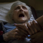 
              An elderly woman who has been evacuated from the Lysychansk area cries moments before departing by train to western Ukraine from the Pokrovsk railway station, Friday, June 10, 2022. (AP Photo/Bernat Armangue)
            