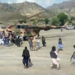 
              In this image taken from video from Bakhtar State News Agency, Taliban fighters secure a government helicopter to evacuate injured people in Gayan district, Paktika province, Afghanistan, Wednesday, June 22, 2022. An earthquake struck eastern Afghanistan early Wednesday, killing at least 255 people, authorities said. (Bakhtar State News Agency via AP)
            