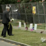 
              Attorney General Merrick Garland places flowers at a memorial set-up for Tops Supermarket shooting victims on Wednesday, June 15, 2022 in Buffalo, N.Y.   Payton Gendron the white gunman who killed 10 Black people in a racist attack at the Buffalo supermarket was charged Wednesday with federal hate crimes that could potentially carry a death penalty. (US Network via AP, Pool)
            