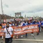 
              Demonstrators calling for gun control march across the Brooklyn Bridge, Saturday, June 11, 2022, in New York. (AP Photo/Jennifer Peltz)
            