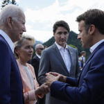 
              From left, U.S. President Joe Biden, European Commission President Ursula von der Leyen, Canada's Prime Minister Justin Trudeau and Emmanuel Macron, Prime Minister of France talk as they attend a family photo opportunity at Castle Elmau in Kruen, near Garmisch-Partenkirchen, Germany, on Sunday, June 26, 2022. The Group of Seven leading economic powers are meeting in Germany for their annual gathering Sunday through Tuesday. (Jonathan Ernst/Pool Photo via AP)
            