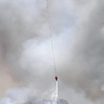 
              An Airbus Helicopters H125 drops water on a portion of a wildfire that was reportedly a control burn that got out of control Wednesday morning, June 15, 2022, near the East Levee Road and Avenue 4 1/2E in the north Gila Valley, Ariz. The fire reportedly was burning on both sides of the Colorado River. (Randy Hoeft/The Yuma Sun via AP)
            
