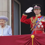 
              Queen Elizabeth II and the Duke of Kent watch from the balcony of Buckingham Palace after the Trooping the Color ceremony in London, Thursday, June 2, 2022, on the first of four days of celebrations to mark the Platinum Jubilee. The events over a long holiday weekend in the U.K. are meant to celebrate the monarch's 70 years of service. (Jonathan Brady/Pool Photo via AP)
            