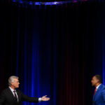 
              Mike Collins, left, and Vernon Jones participate in Georgia's 10th Congressional District republican primary election runoff debates on Monday, June 6, 2022, in Atlanta. (AP Photo/Brynn Anderson)
            