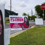 
              Signs for Republican congressional candidate Mayra Flores decorate the lawn outside a polling location Tuesday, June 14, 2022, for the Special Election for Congressional District 34 in Harlingen, Texas. (Denise Cathey/The Brownsville Herald via AP)
            