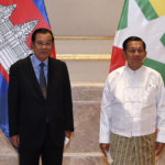 
              FILE - In this photo provided by An Khoun Sam Aun/National Television of Cambodia, Cambodian Prime Minister Hun Sen, left, poses for photographs together with Myanmar State Administration Council Chairman, Senior General Min Aung Hlaing, right, before holding a meeting in Naypyitaw, Myanmar, on Jan. 7, 2022.  Hun Sen has urged military-ruled Myanmar to reconsider the death sentences given four political opponents, suggesting that executing them will draw strong international condemnation and complicate efforts to restore peace to the strife-torn nation.(An Khoun SamAun/National Television of Cambodia via AP, File)
            